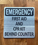 silver-emergency-first-aid-cpr-kit-behing-counter-building-notice.jpg