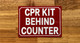 cpr-kit-behind-counter-sign-red-equipment-notice.jpg