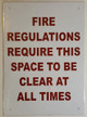 FIRE REGULATION REQUIRE THIS SPACE TO BE CLEAR AT ALL TIMES SIGNAGE