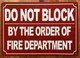 FD DO NOT BLOCK BY ORDER OF FIRE MARSHAL SIGN