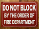 HPD DO NOT BLOCK BY ORDER OF FIRE MARSHAL SIGN