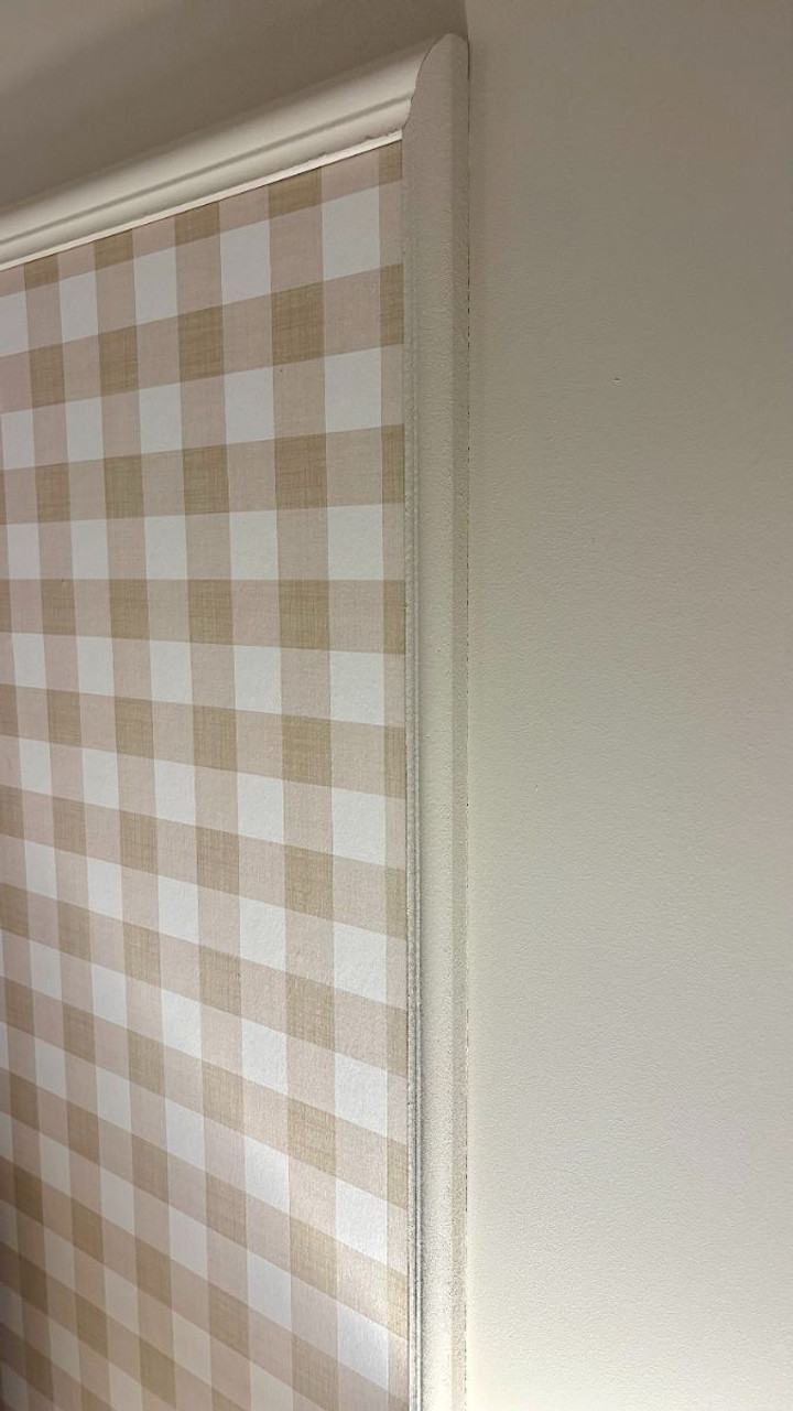 Close-up detail showing panel moulding frame containing gingham wallpaper