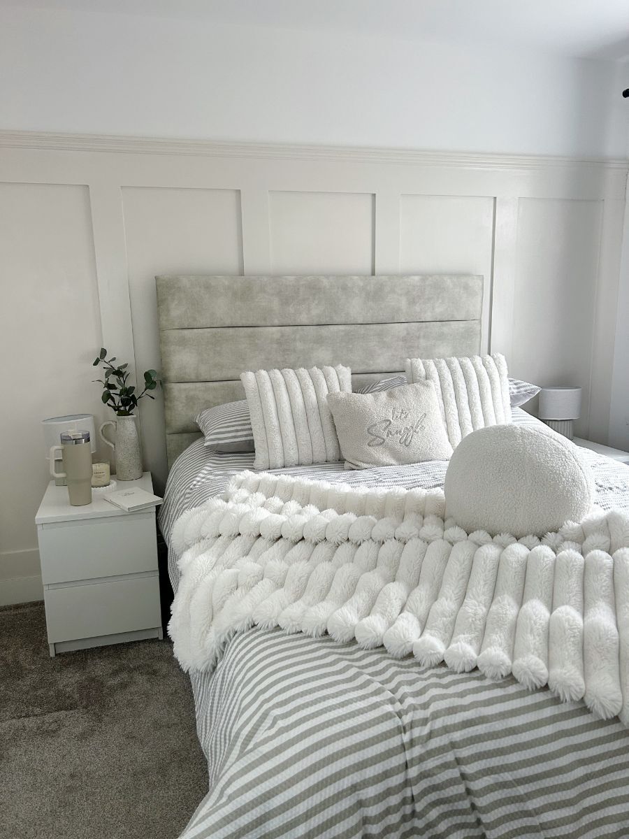 Completed bedroom with bed placed against three-quarter height shaker wall panelling, showing how the feature enhances the furniture arrangement