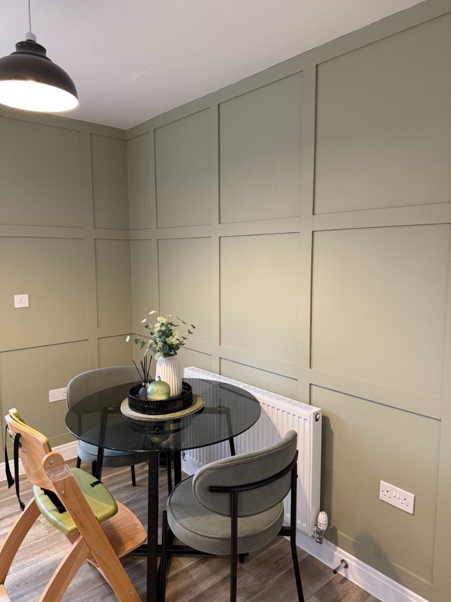 Close-up detail of shaker wall panelling in a dining room showing the precise construction and clean lines of the panelling