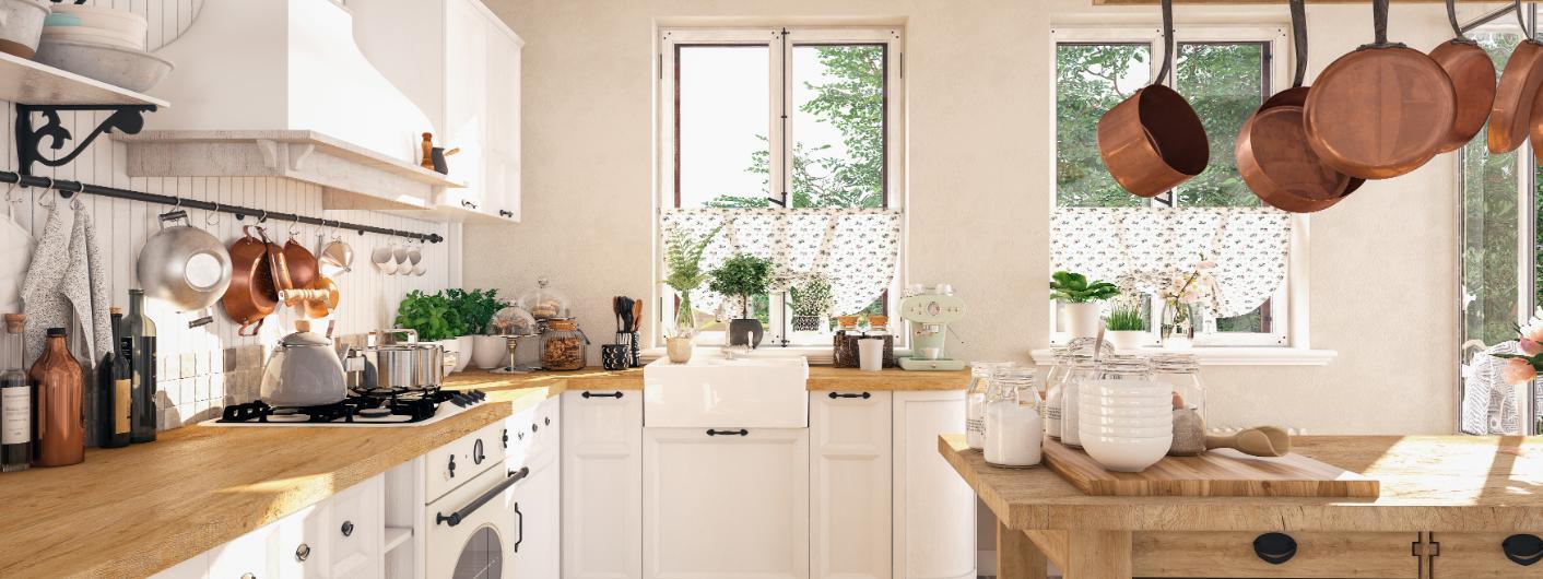 Traditional farmhouse kitchen with white beadboard panels and copper pans