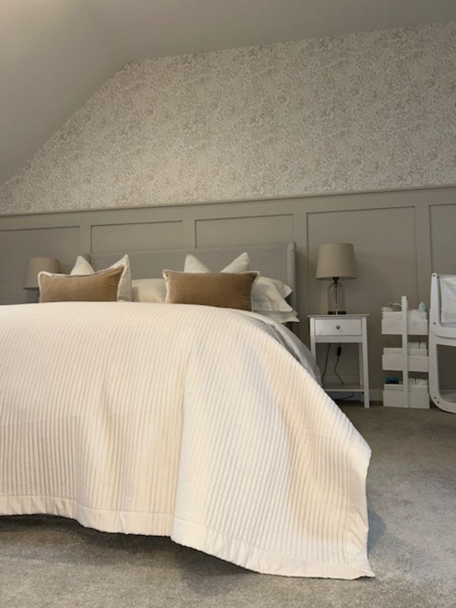 Bedroom with half-wall shaker panelling creating a cosy and stylish atmosphere