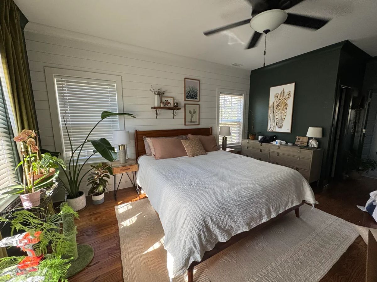 Bedroom with horizontal tongue and groove panelling covering an entire wall, adding warmth and texture to the space