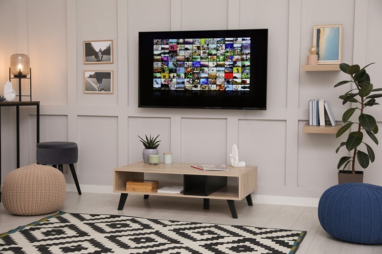 Scandi-inspired living room featuring a panelled media wall in soft neutral tones.