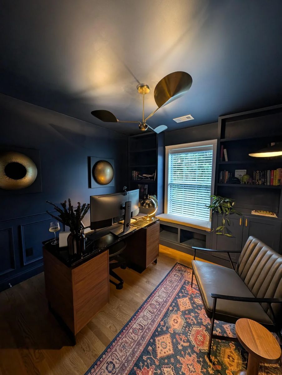 Full view of the mid-century room with navy blue half-wall wainscoting showing how the panelling complements the overall design