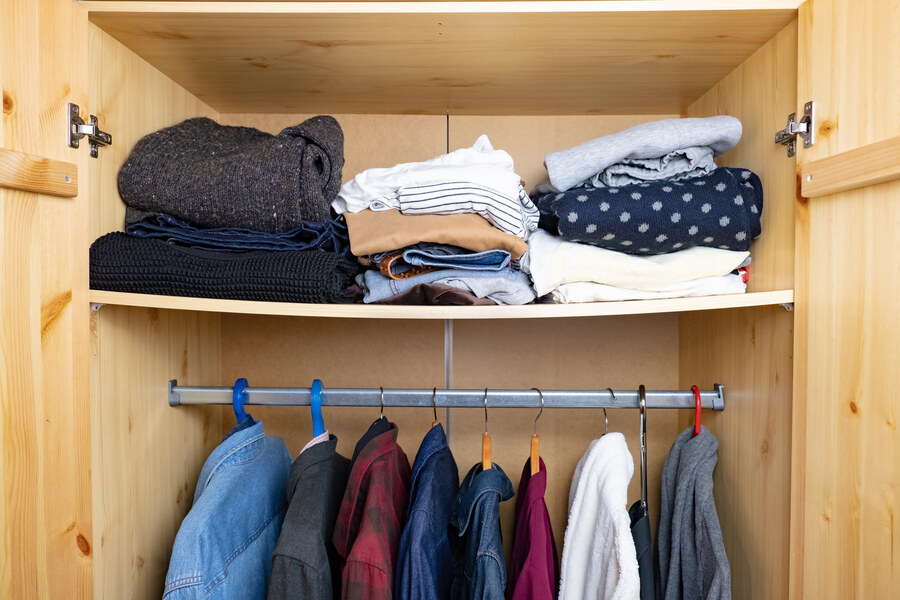 MDF shelf in wardrobe showing visible sagging in the middle due to inadequate support