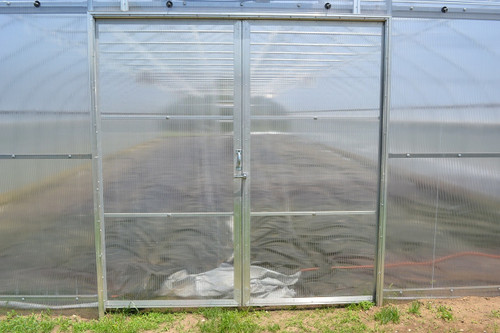 Double sliding greenhouse doors with polycarbonate panels