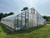 Insect mesh installed on a high tunnel greenhouse.