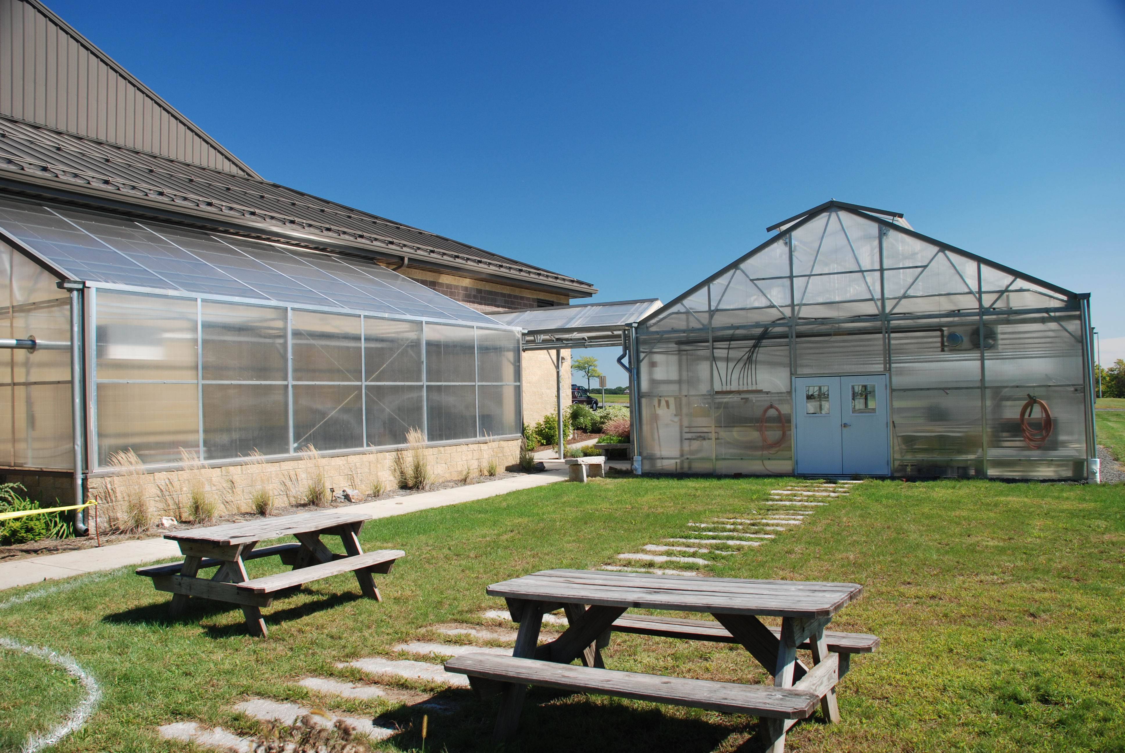 A Rimol Matterhorn and a lean-to greenhouse used for education at a school