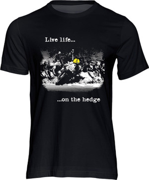 What can we say about this T-shirt other than it totally sums up the ethos of real road racing: Live life on the hedge.

Yer Maun is still very much a presence at the TT but this image captures an era and an ethos that's rapidly fading.

The fans sit on the hedge watching in awe as the most successful TT rider of all time hustles the 125cc Honda through in his seemingly effortless way.

It is a great reminder of the prowess of Joey that in his final TT appearance, at the age of 47, he recorded his fastest ever lap. 

Let the world know that you are part of the real road racing tribe with this iconic new design.