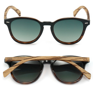 With vintage inspired details this iconic style in black with tortoise accents is the perfect all-rounder.  Featuring khaki polarised lenses and slim walnut wood arms, this mid-size style suits all face shapes and sizes.