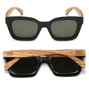 Our best-selling, 90s inspired Zahra sunglasses are a mid-sized style that will suit most face shapes and sizes. Zahra sunglasses are now available in a classic midnight black with polarised khaki tinted lenses.

Details

Model: Zahra Midnight
Colour: Black Wooden Sunglasses
Wooden Arms: Walnut Wood
Wood: FSC Certified Sustainable Wood, Eco Friendly
Lens: Khaki Polarised UV 400 Protection
Polarised: YES
Prescription Compatible: YES
Gender: Unisex
Shape: Frame Rectangle
Brand:? OEK Eco Friendly Australian Brand
Dimensions

Frame Width: 143mm
Frame Height: 49mm
Arm Length: 147mm
Bridge Width: 20mm