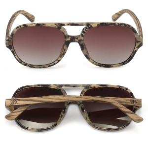 With its laid back attitude, Billy is the must-have aviator for summer.  This 70s inspired silhouette has flattering unisex proportions and suits most face shapes and sizes.  Finished in a classic opal tort with walnut wood arms it exudes a carefree spirit.