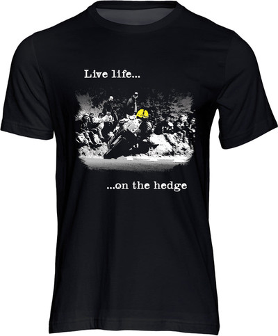 What can we say about this T-shirt other than it totally sums up the ethos of real road racing: Live life on the hedge.

Yer Maun is still very much a presence at the TT but this image captures an era and an ethos that's rapidly fading.

The fans sit on the hedge watching in awe as the most successful TT rider of all time hustles the 125cc Honda through in his seemingly effortless way.

It is a great reminder of the prowess of Joey that in his final TT appearance, at the age of 47, he recorded his fastest ever lap. 

Let the world know that you are part of the real road racing tribe with this iconic new design.