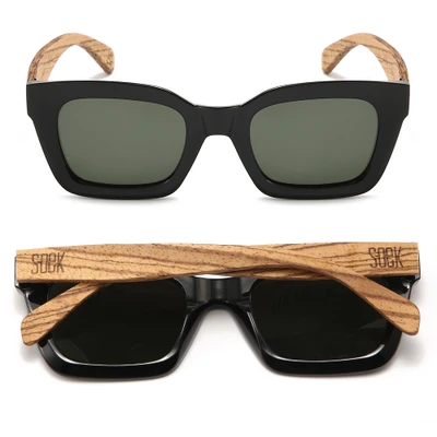Our best-selling, 90s inspired Zahra sunglasses are a mid-sized style that will suit most face shapes and sizes. Zahra sunglasses are now available in a classic midnight black with polarised khaki tinted lenses.

Details

Model: Zahra Midnight
Colour: Black Wooden Sunglasses
Wooden Arms: Walnut Wood
Wood: FSC Certified Sustainable Wood, Eco Friendly
Lens: Khaki Polarised UV 400 Protection
Polarised: YES
Prescription Compatible: YES
Gender: Unisex
Shape: Frame Rectangle
Brand:? OEK Eco Friendly Australian Brand
Dimensions

Frame Width: 143mm
Frame Height: 49mm
Arm Length: 147mm
Bridge Width: 20mm
