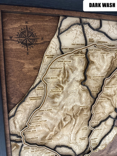 The layers are laser cut from different woods, each selected to add contrast and warmth to the piece. The front title layer and sea below are engraved mahogany or Walnut. The road course is engraved with a thin racing stripe and pops out brightly from the background levels.