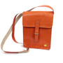 This compact bag has a lovely Tangerine hue, and is made of genuine leather. 