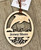 The ornament is approximately 3.25” x 2.75” on a suede cord for hanging. The natural color of the wood will vary depending on the natural grains and color of the wood. 