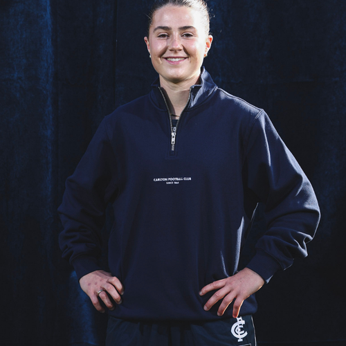 Front view of the Carlton Women's Signature 1/4 Zip top by NAR worn by a model.