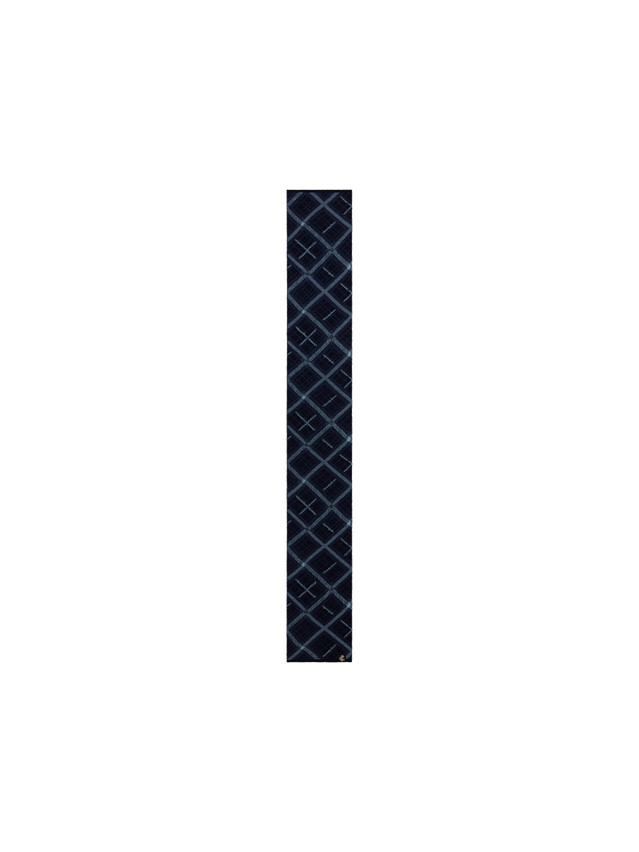 Close-up of the logo patch on the Carlton Fashion Scarf.