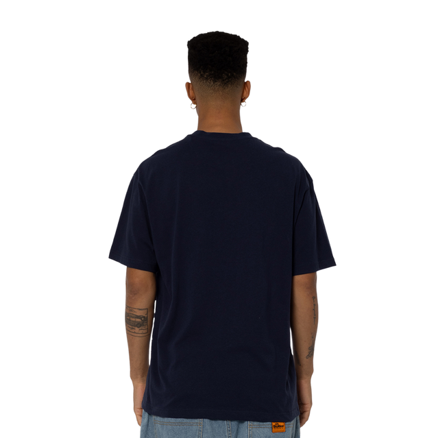 Lifestyle front shot of the '95 Premiership Team Tee worn by a model.