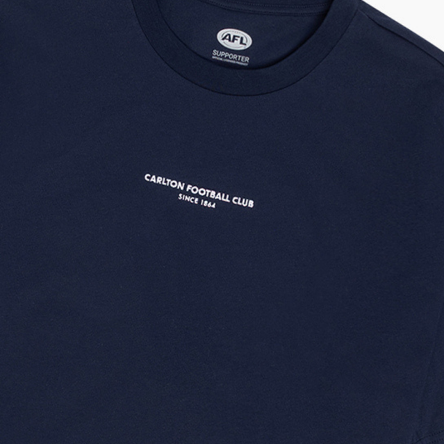 Back view of the navy Carlton Women's Signature Tee worn by a model.