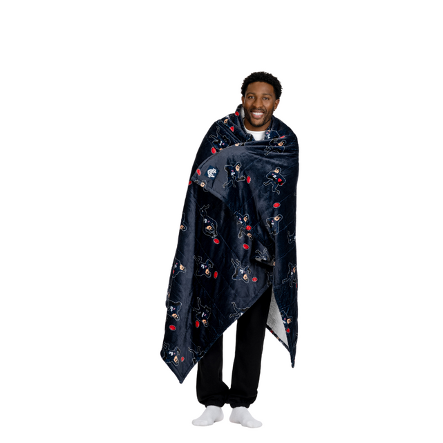 Lifestyle image of the Carlton Oodie Blanket used on a couch.