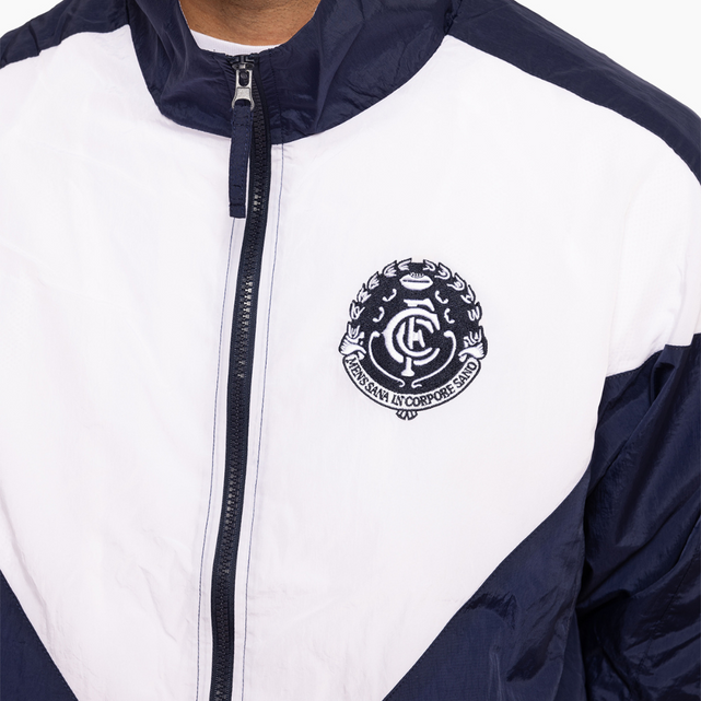 Close-up of the chest logo on the Full Zip Through Spray Jacket.