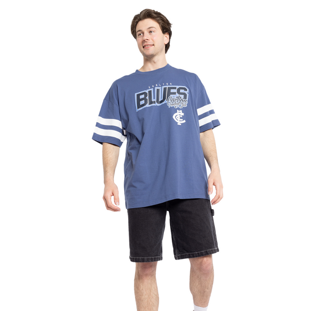 Side view of the Carlton Mens Multi Logo Tee in Blue.