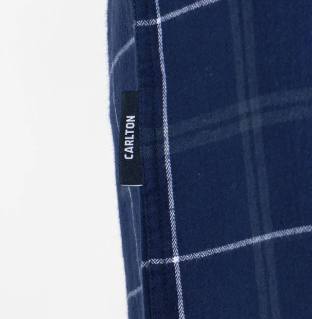Close-up of the pocket and logo on the Carlton Flannel Shirt.