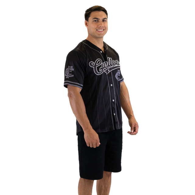 Back view of the Carlton Men's Blackout Baseball Shirt worn by a model.