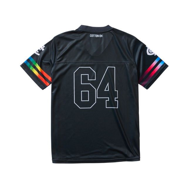 Back view of the 2025 Cotton On S10 Adults Pride Gridiron Tee worn by a model.