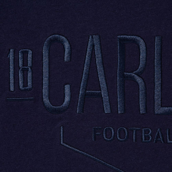 Close-up of the embossed detail on the Carlton 1864 Women's Navy Tee.