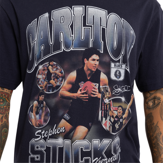 Lifestyle back shot of the Carlton Sticks Arch Tee worn by a model.