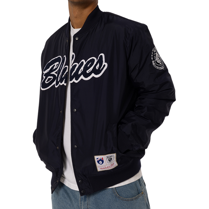 Lifestyle back shot of the '95 Nylon Bomber Jacket worn by a model.