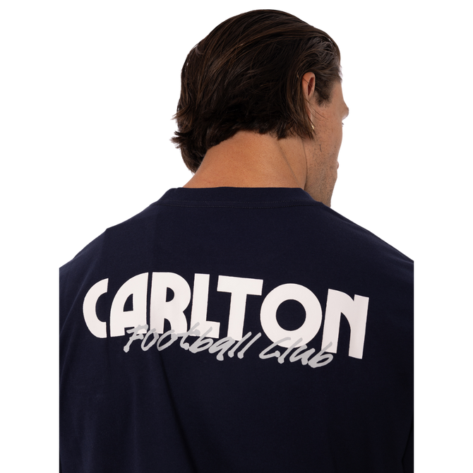 Lifestyle front shot of the Men's Throwback Logo Tee worn by a model.