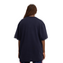 Angled side view of the Carlton Sticks Arch Tee.