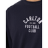 Close-up of the chest embroidery on the 2025 Men's Lock-Up Tee.