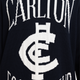 Close-up of the chest logo on the Mens Supporter Knit Crew.