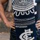 Scarf folded showing the Carlton Indigenous design elements.