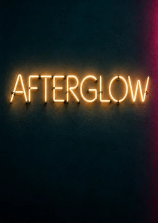 Warm white-yellow neon letters spelling AFTERGLOW on a dark teal wall, with an amber halo and magenta glow along the right edge.