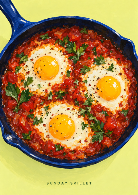 Three sunny eggs with golden yolks in tomato-red sauce in a cobalt-blue skillet, with herbs and the words Sunday Skillet below.