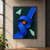 Cobalt-blue ribbon forms a broad loop around an orange disk, with two pale mint fragments on a deep teal background.; frame shown for styling only