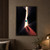 A turquoise sphere hangs in a narrow beam of warm light between dark slabs, with a coral shadow and fine saffron line.; frame shown for styling only
