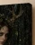Feral Blossom Dryad Art Print, flower-crowned figure in a shadowy forest - matte canvas - exact closeup