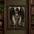 Full-length tattooed woman with bowed head and large black feathered wings against a distressed pale wall.; frame shown for styling only